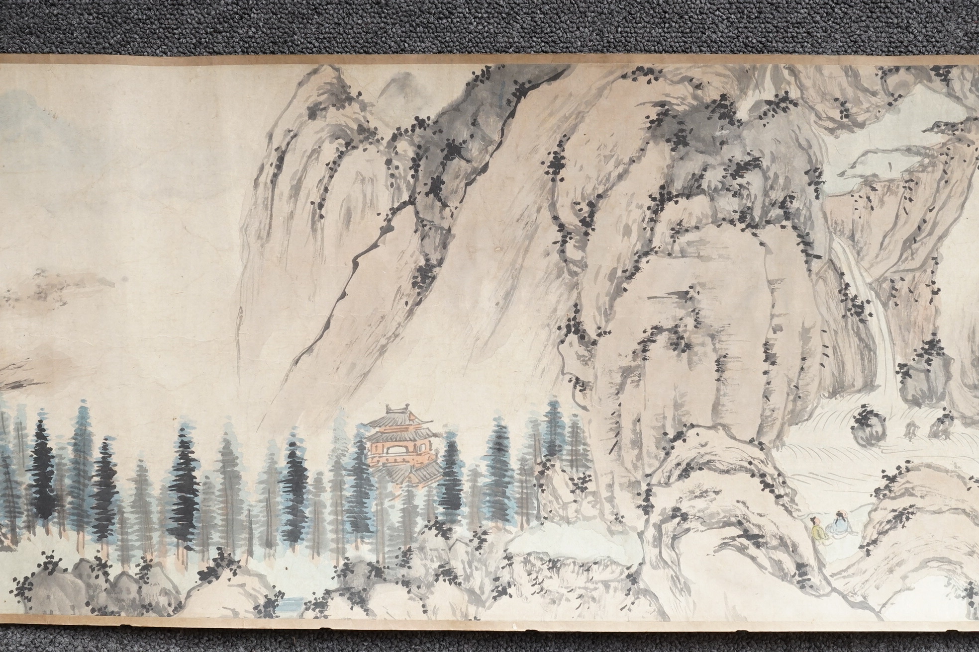 Chinese School , (Qing dynasty), Figures in a mountainous river landscape, Ink and colour on paper handscroll, 268.5cm x 29cm excluding borders